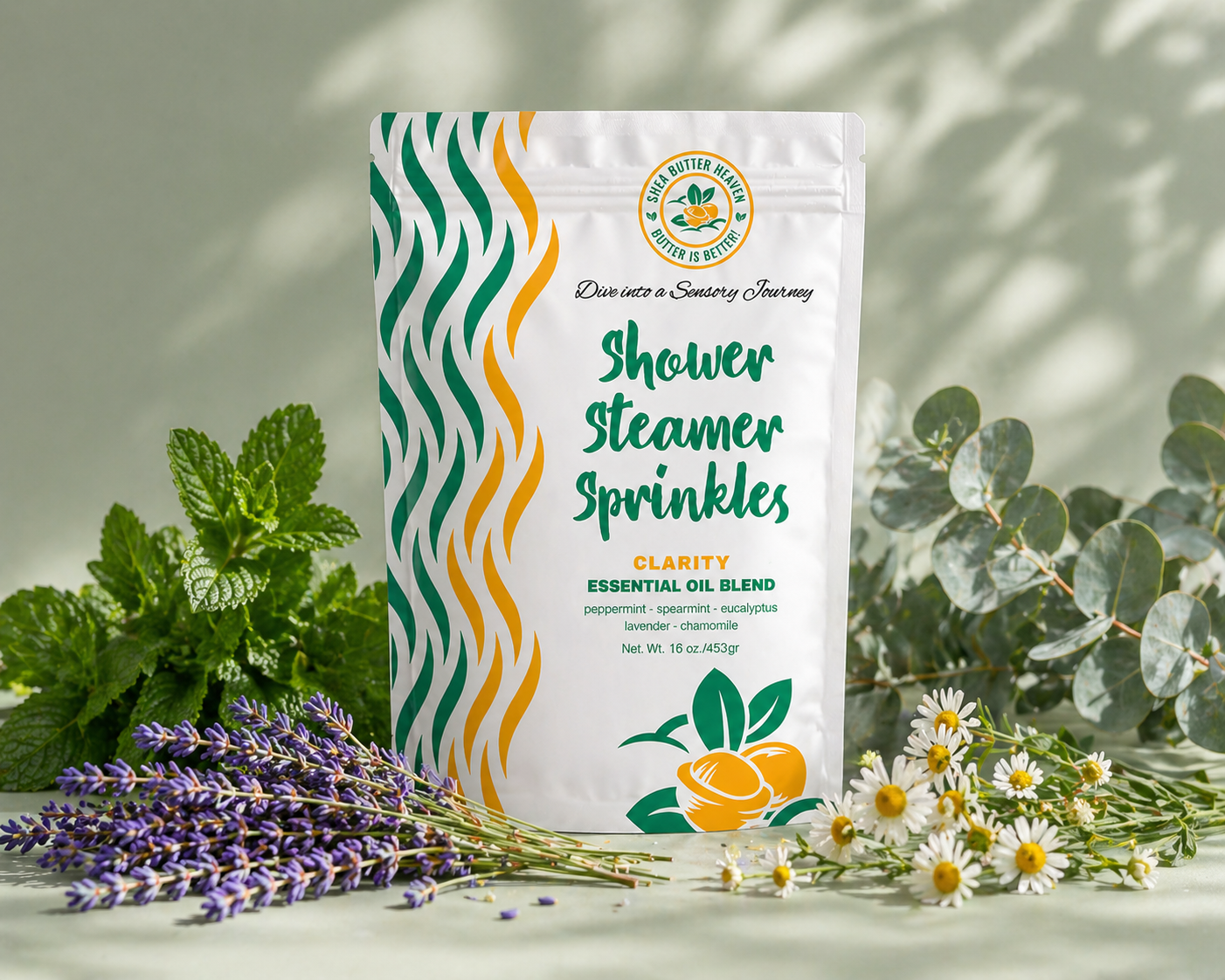 Clarity Shower Steamer Sprinkles pouch on a soft sage background with mint, lavender, eucalyptus, and chamomile flowers in a clean botanical spa setting