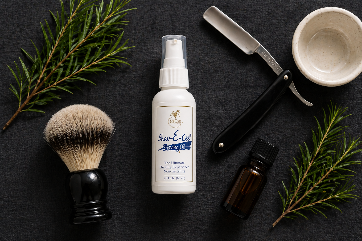 Shav-E-Cee Shave Oil bottle in overhead flatlay with straight razor, shave brush, and botanical sprigs on dark linen — by Shea Butter Heaven