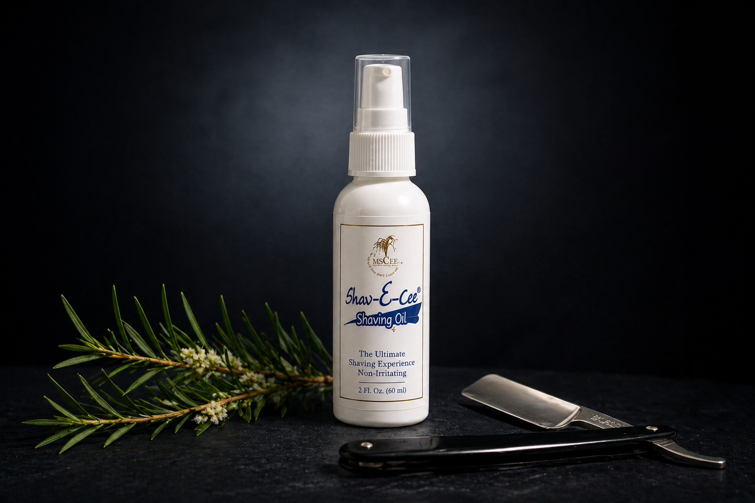 Shav-E-Cee Shave Oil bottle on dark charcoal background with dramatic spotlight and botanical sprig — by Shea Butter Heaven