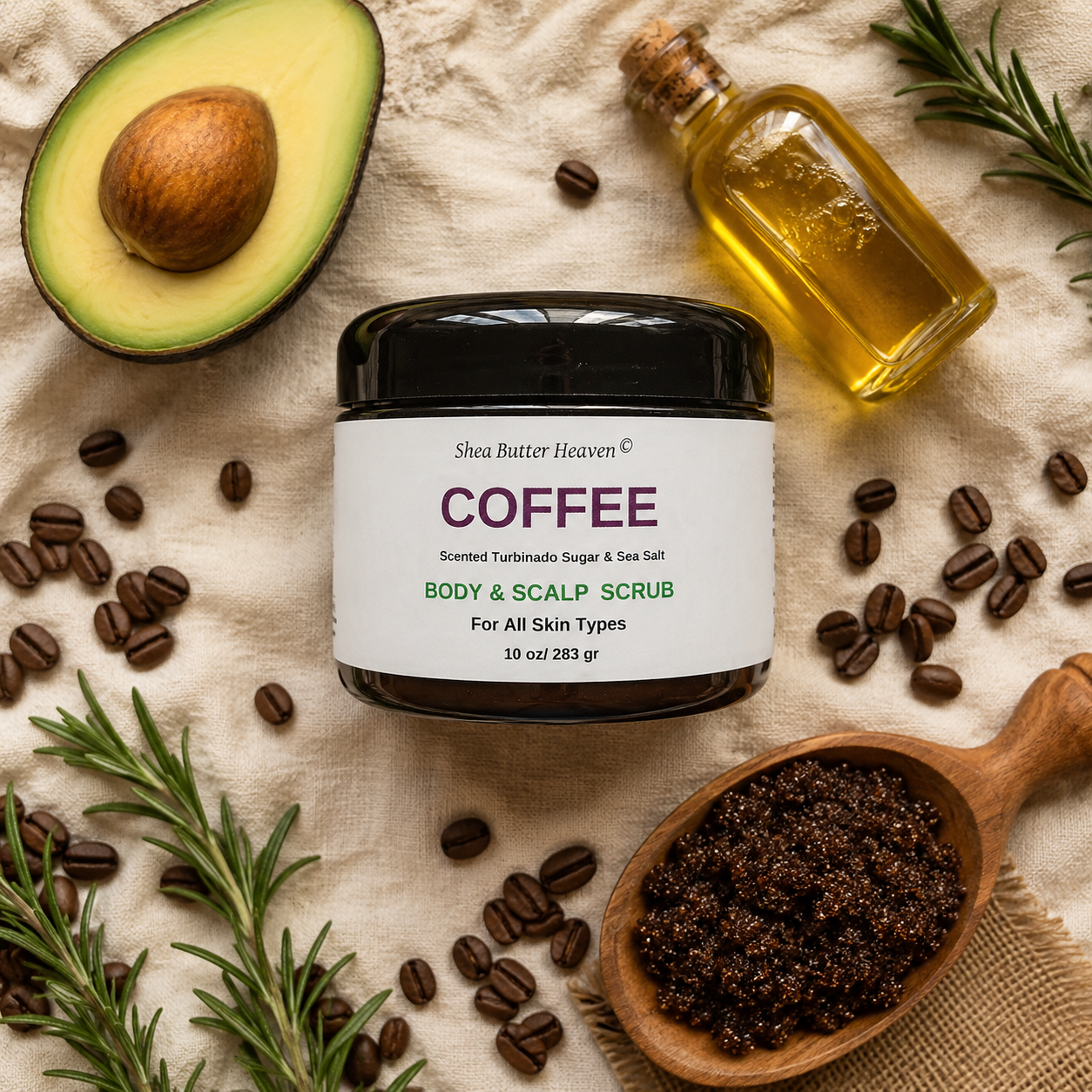 Botanical flat lay of Shea Butter Heaven Coffee Body and Scalp Scrub surrounded by coffee grounds, avocado, neem, and rosemary on a warm cream linen background