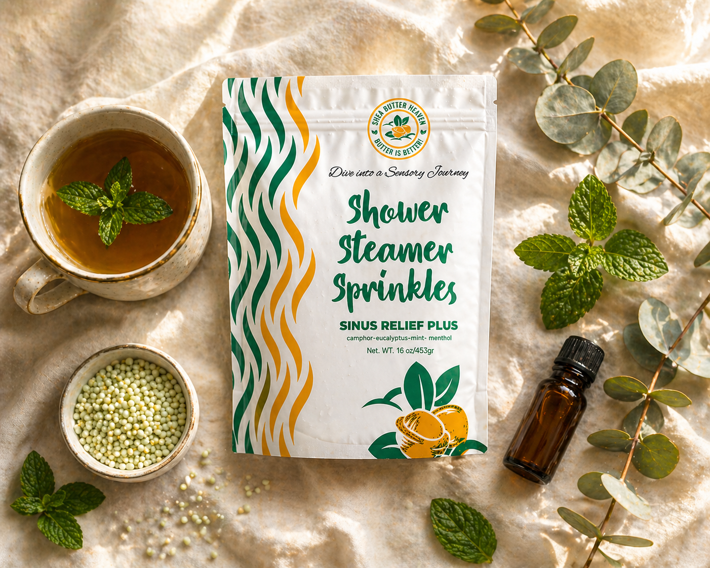 Sinus Relief Plus Shower Steamer Sprinkles pouch in a morning wellness flat lay with tea, mint leaves, eucalyptus, and essential oil on a linen surfac